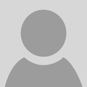 A gray, generic user profile icon with a circular head and shoulders on a light gray background, often used as a placeholder for a profile picture.